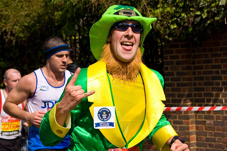 13537132 - london - april 22: unidentified people run the london marathon on april 22, 2012 in london, england, uk. the marathon is an annual event.