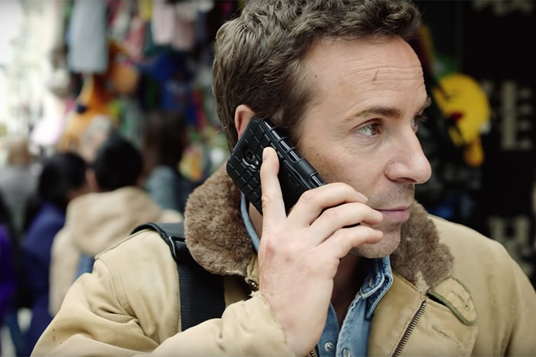 Alessandro Nivola as Lee Berger on cellphone in "Chimerica" trailer