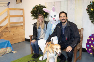 Kelly Gurdeniz, Ege Gurdeniz and their furbaby Atticus pose with the Easter Bunny