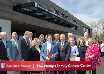 Cutting the red ribbon at the Phillips Family Cancer Center