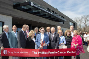 Cutting the red ribbon at the Phillips Family Cancer Center