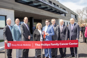 Cutting the red ribbon at the Phillips Family Cancer Center