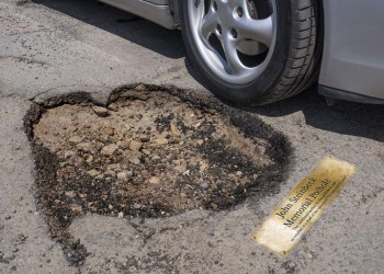Render of the proposed John Steinbeck Memorial Pothole - brass plaque next to pothole with car passing