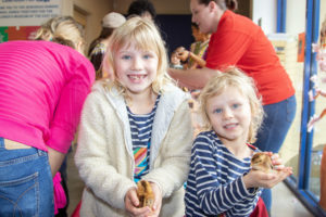 Charlotte age 7 and Pressly age 5 hold cute chicks