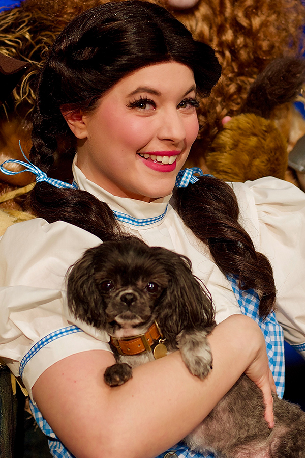 Ashley Ferraro as Dorothy and Mia as Toto in "The Wizard of Oz" at Theatre Three