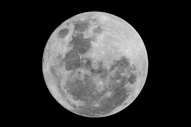 Super full moon on black background