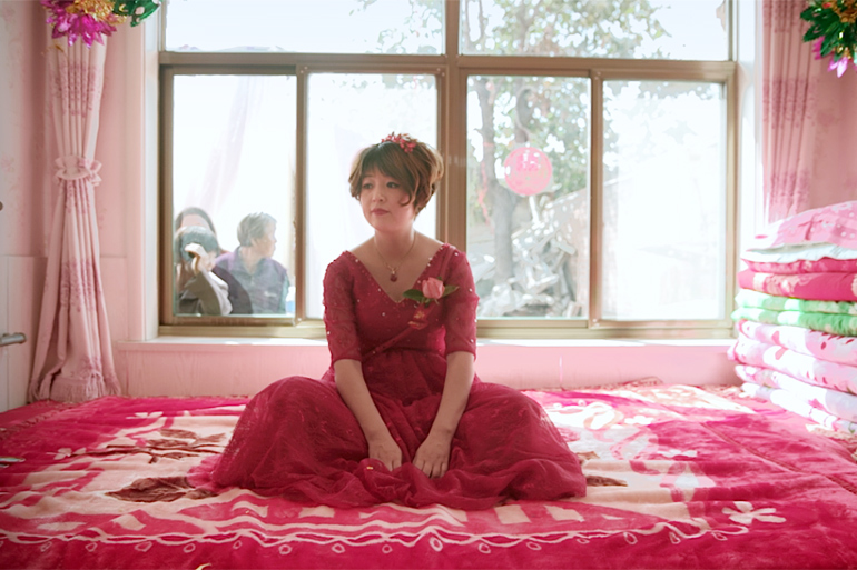 Gai Qi in her wedding dress in "Leftover Women"