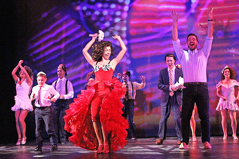 Marina Pires and Eddie Noel as Gloria and Emilio Estefan, with the Company of “On Your Feet,” Photo: Jeff Bellante