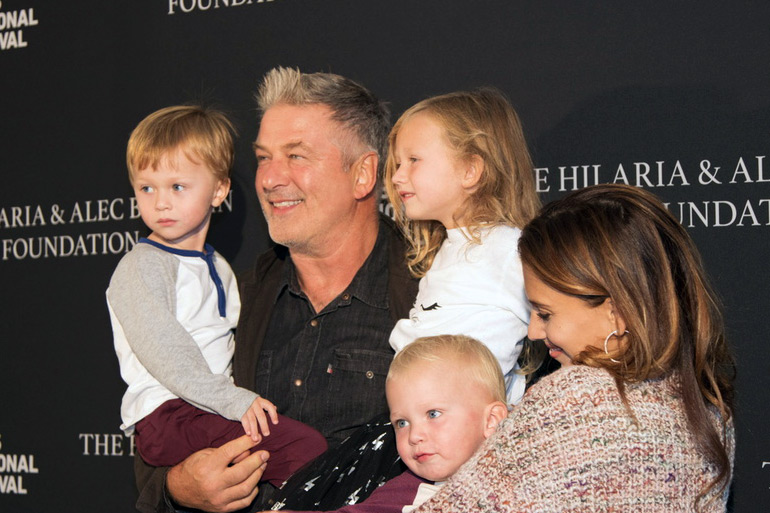 Proud father Alec Baldwin with wife Hilaria and their kids