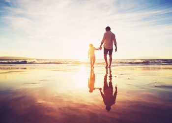 Father and son on beach
