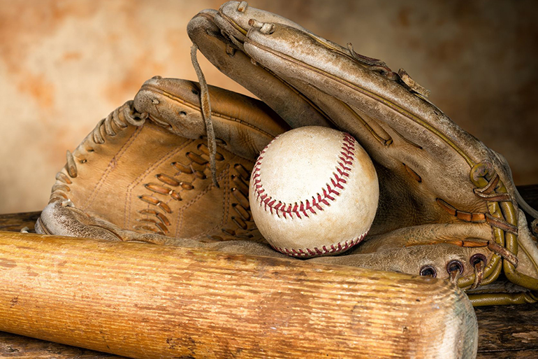baseball bat with ball and old weathered glove