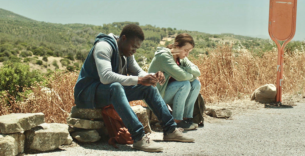 Basim and Anna meet at a bus stop in "Twin Flower"