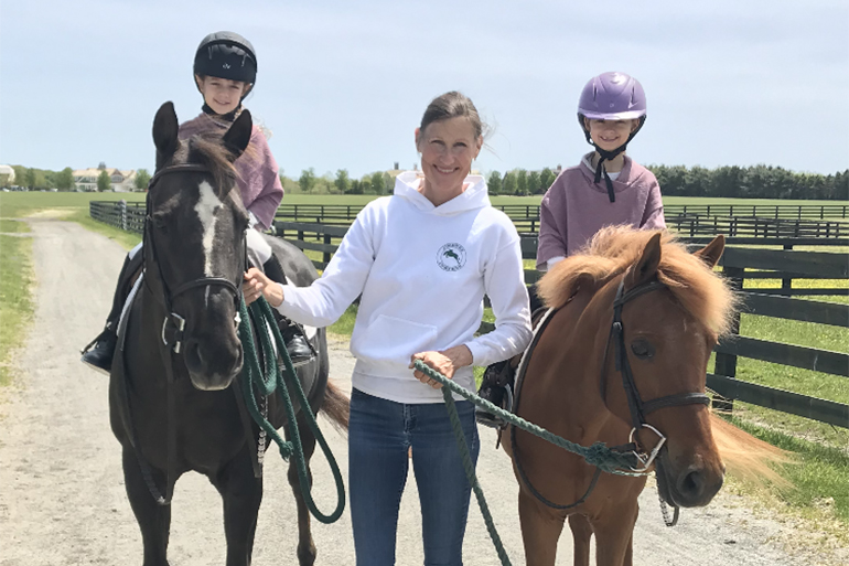 Joanne Jimenez and her students, Photo: Courtesy Jimenez Jumpers