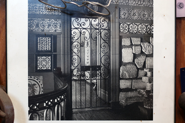 A photo of Battle's Hispanic Society gates hangs in his metalshop