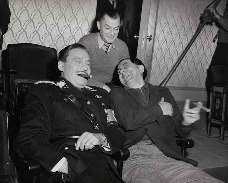 Lubitsch and Jack Benny share a laugh on the set of "To Be of Not to Be"