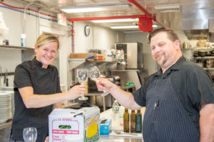 Chef Jennilee Morris and Matthew Boudreau toast to a great event