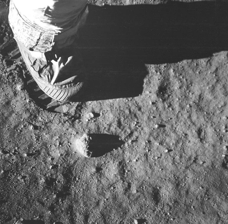 Neil Armstrong steps onto the lunar surface