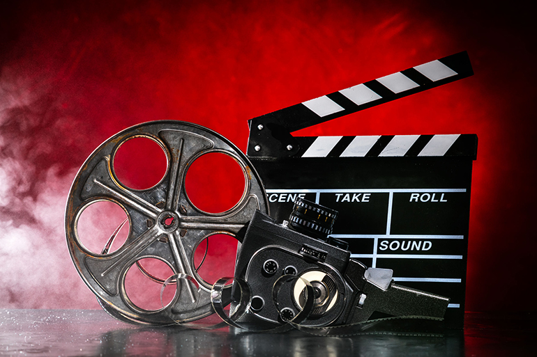 Retro film production accessories still life. Concept of filmmaking. Smoke effect on background