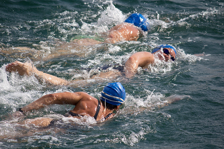 unknown athletes compete in the 20th annual 2,000 meter valencia port swim in the port of valencia on july 22, 2012 in valencia, spain.