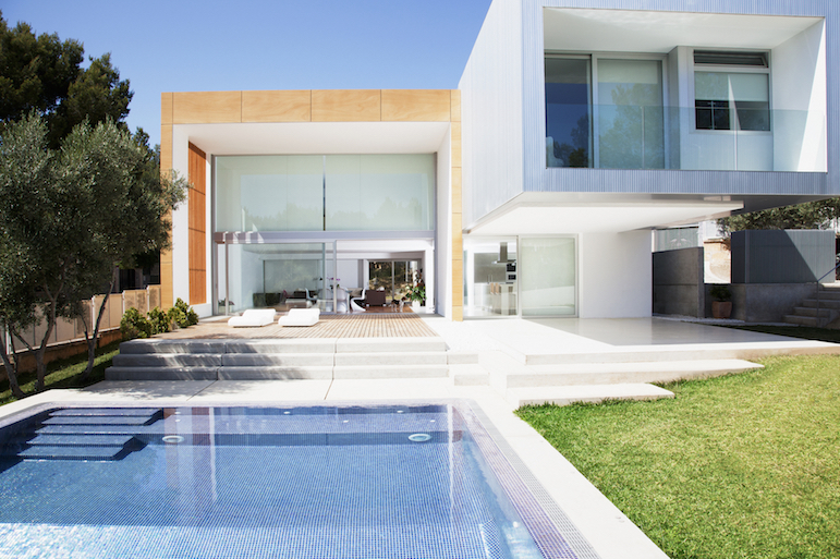 Pool outside modern house