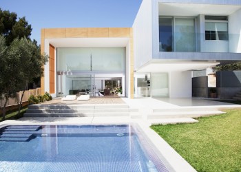 Pool outside modern house