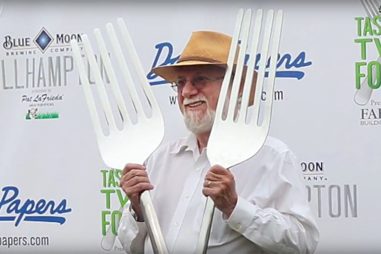 Dan Rattiner holding two giant forks