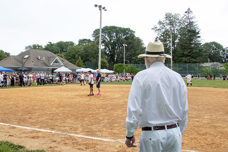 Dan watches Clinton umpire the 2019 Artists & Writers Game