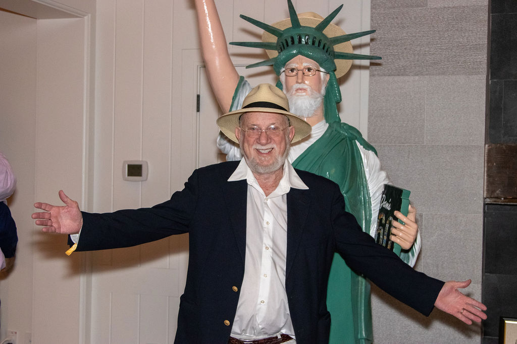Dan Rattiner with statue
