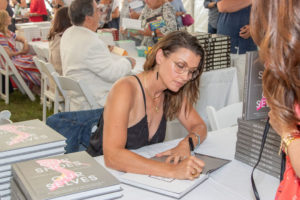Bridget Moynahan signing books for a friend
