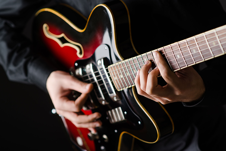 Man with guitar during concert