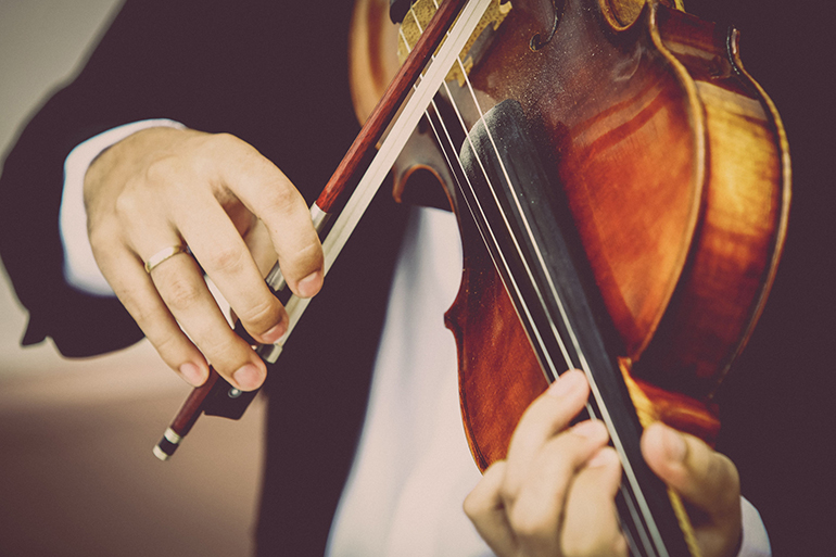 Detail of viola being played by a musician