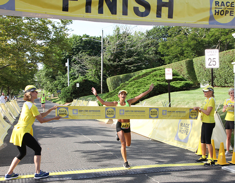 Tara Farrell at the finish line Race of Hope 2019