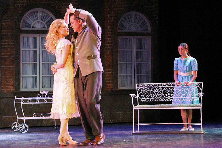 Maria (Brandi Burkhardt) dancing with Captain von Trapp (Ryan K. Bailer) as Brigetta (Allie DeMatteo) looks on in The Gateway's "The Sound of Music," Photo: Jeff Bellante