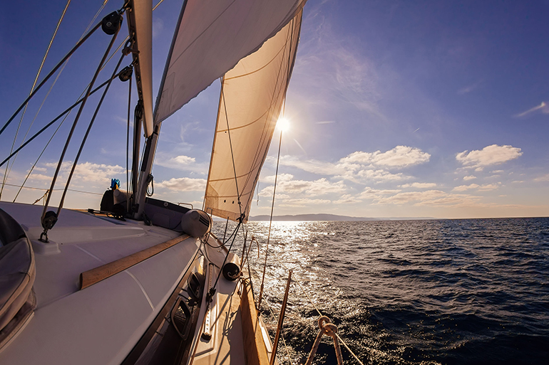 Sailing boat wide angle view in the sea, instagram toning