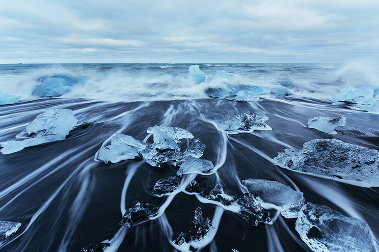 Jokulsarlon glacier lagoon, fantastic sunset on the black beach, Iceland