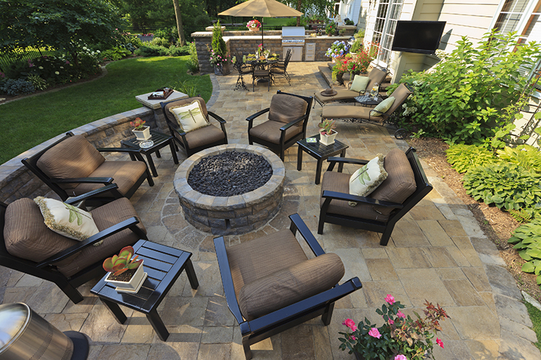 Back yard gardens and patio from an elevated view.