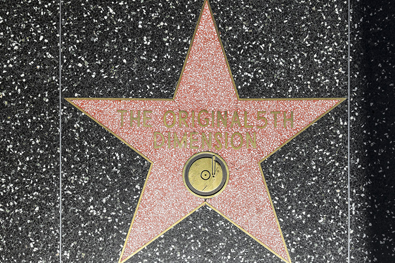 14629166 - hollywood - june 26: the original 5th dimensions star on hollywood walk of fame on june 26, 2012 in hollywood, california. this star is located on hollywood blvd. and is one of 2400 celebrity stars.