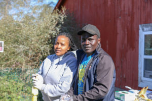 Barbara Wachuka and Gilbert Malele roasting corn at Oktoberfest