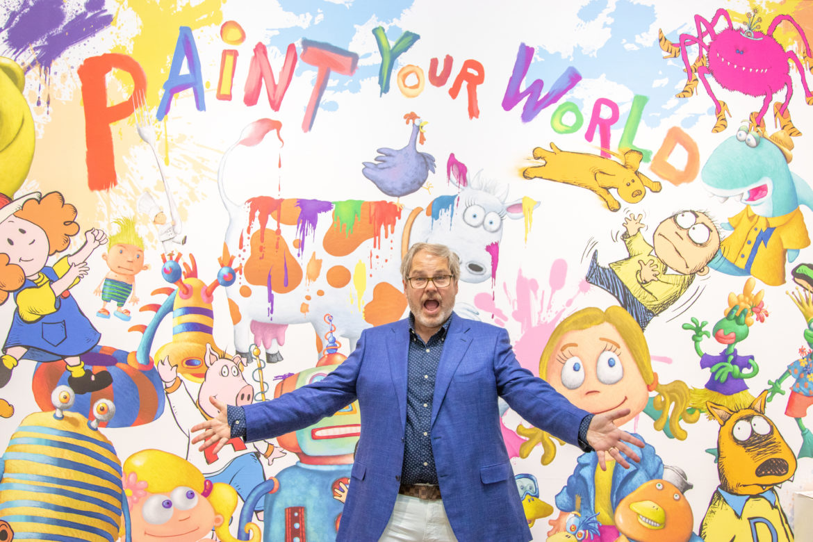 Mickey Paraskevas at his "Paint Your World" exhibition