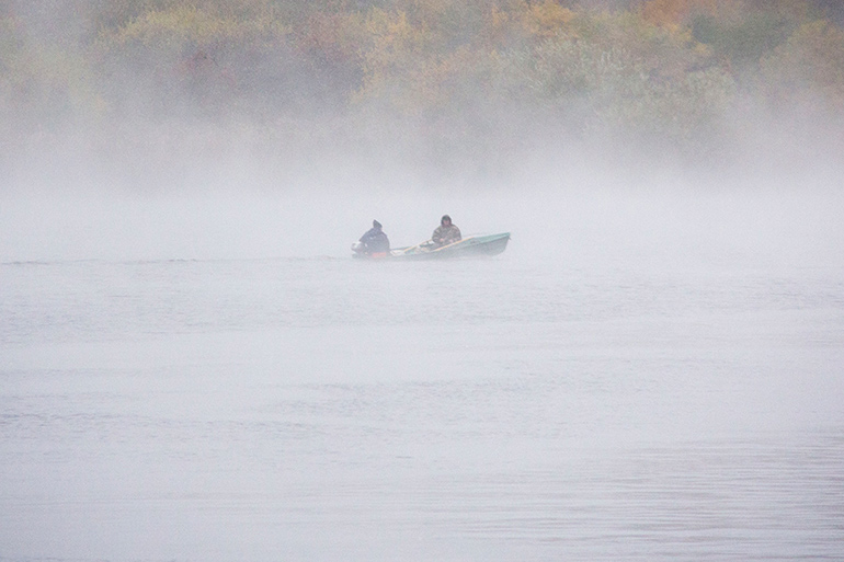 Searching for the Long Pond Monster in boat on misty water