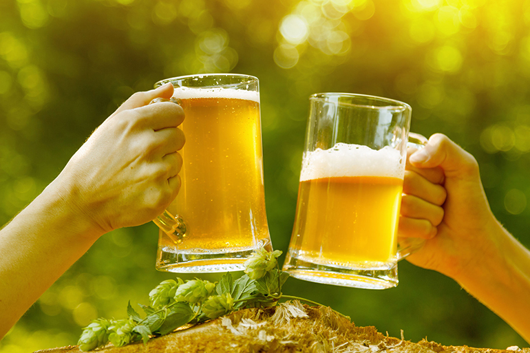 Man hand clink beer woman nature fun octoberfest.