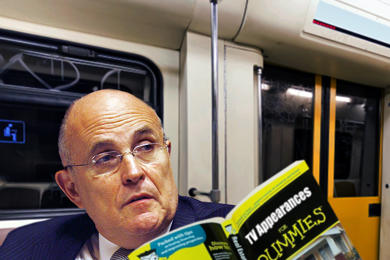 Rudy Giuliani on the Hamptons Subway reading TV Appearances for Dummies