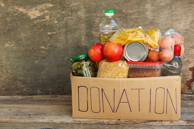 Lots of food in a box labeled "donation" for food pantry