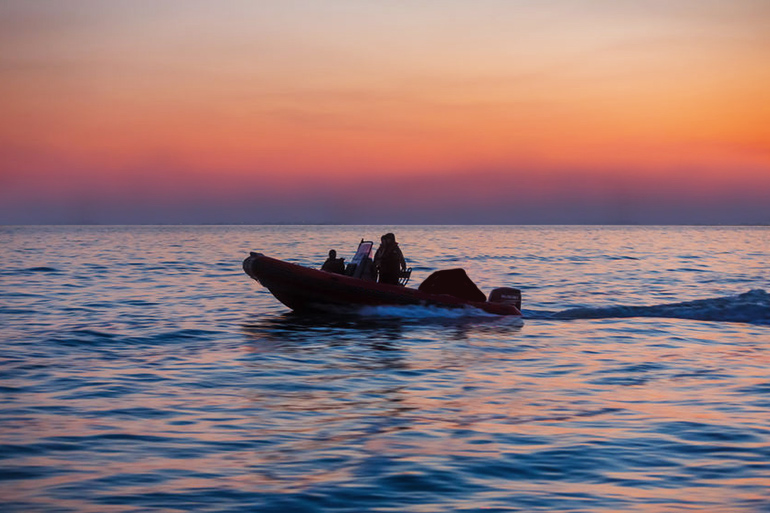 Gardiners Island treasure hunters aboard their skiff