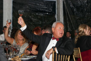NY Cancer Board Member Mark Santos raising a glass