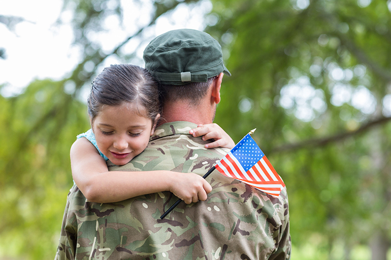 Soldier reunited with his daughter on a sunny day