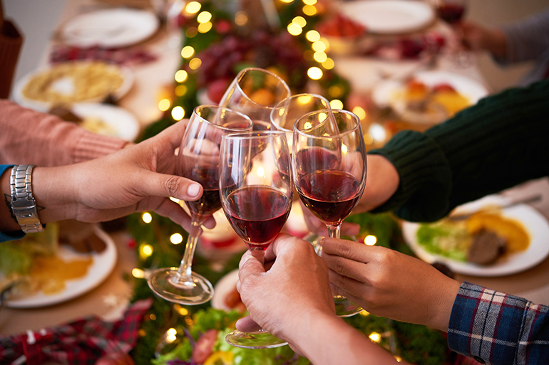 Group of people toasting for Christmas