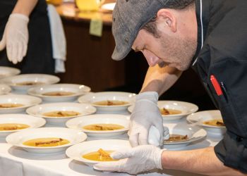 Frisky Oyster assistant chef prepping dishes at Dan's Holidays in the Vines