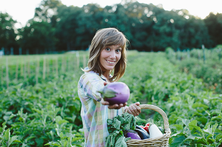 ­­Cristina Cosentino presenting vegetables from Sylvester Manor Educational Farm