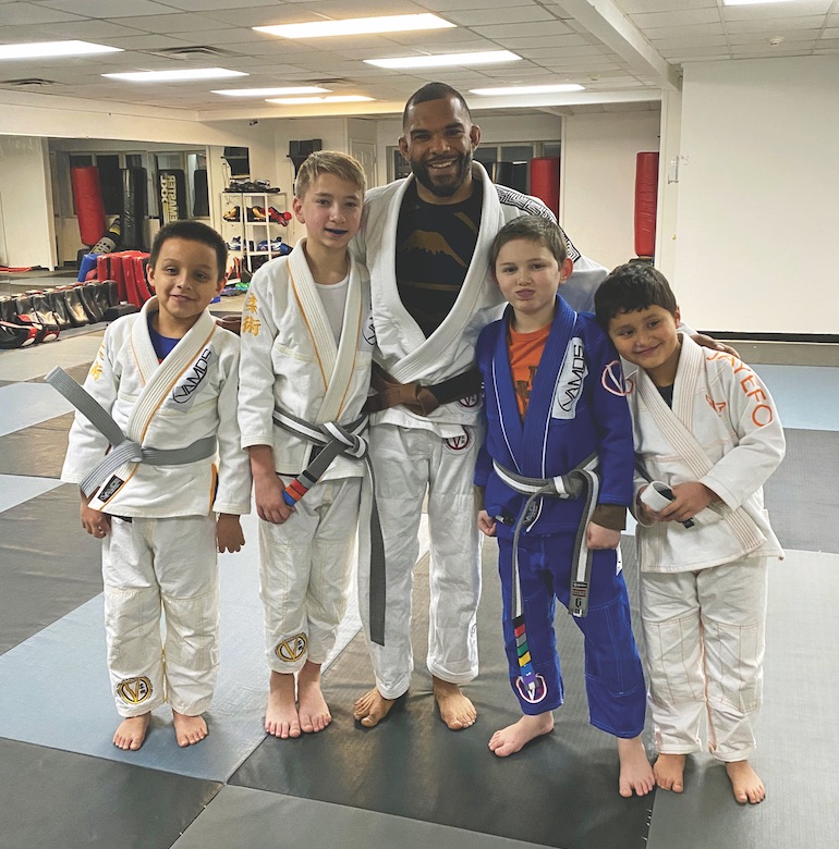 Ian Hill with young students